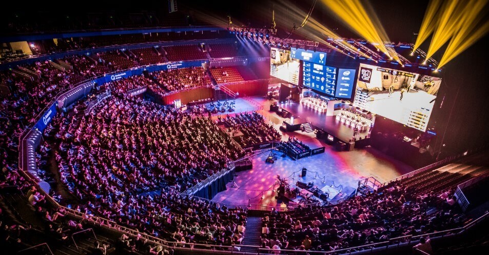 Esports arena filled with fans watching a competitive gaming match
