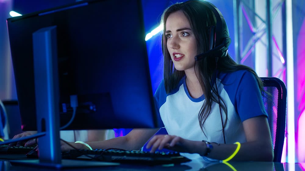 Esports gaming setup with tournament players competing on PCs
